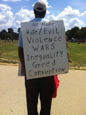D.C. native Calvin Gilliam, 63, with his homemade sign. 