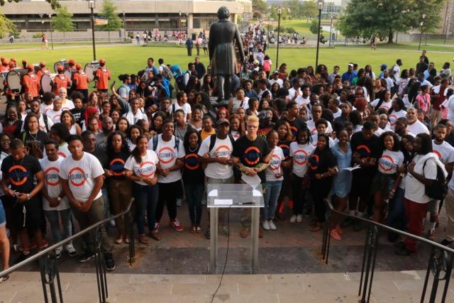 Students, faculty and staff linked arms together to show unity at the rally for peace called "MSUnified." Photo by Terry Wright, Staff Photographer