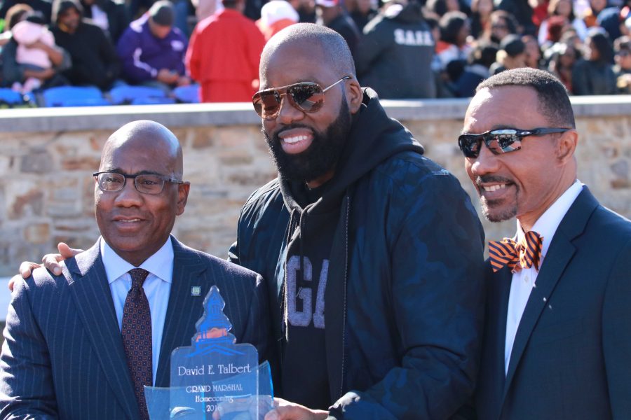 Morgan alum and producer of Almost Christmas David Talbert (center) along with campus president David Wilson (left) and Kweisi Mfume (right) at halftime of the 2016 homecoming football game.