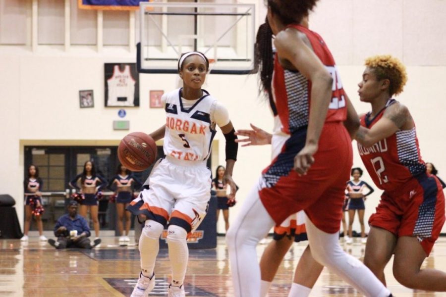 Junior guard Breanan Farrar dribbles for an opening against Howard University last season.
Photo by Terry Wright.