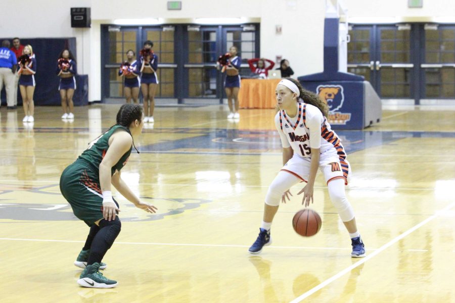 Sophomore guard Chelsea Mitchell prepares to run a play in a 61-26 loss to FAMU.
Photo by Wyman Jones.