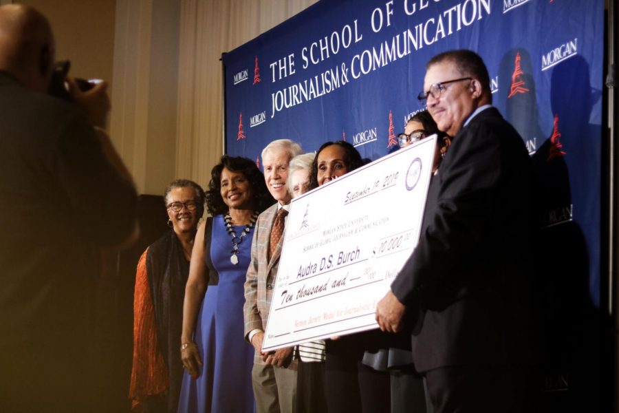 Burch accompanied the deans of SGJC with her award. 