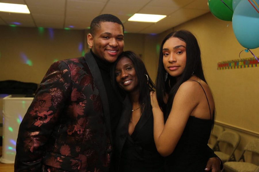 Brianna (right) poses with her mother Trina Murray (middle) and brother Shane Taylor (left) at her grandmothers 80th birthday party. 