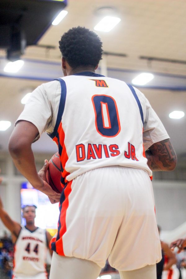 Stanley Davis Jr. anticipates his next move on the basketball court.