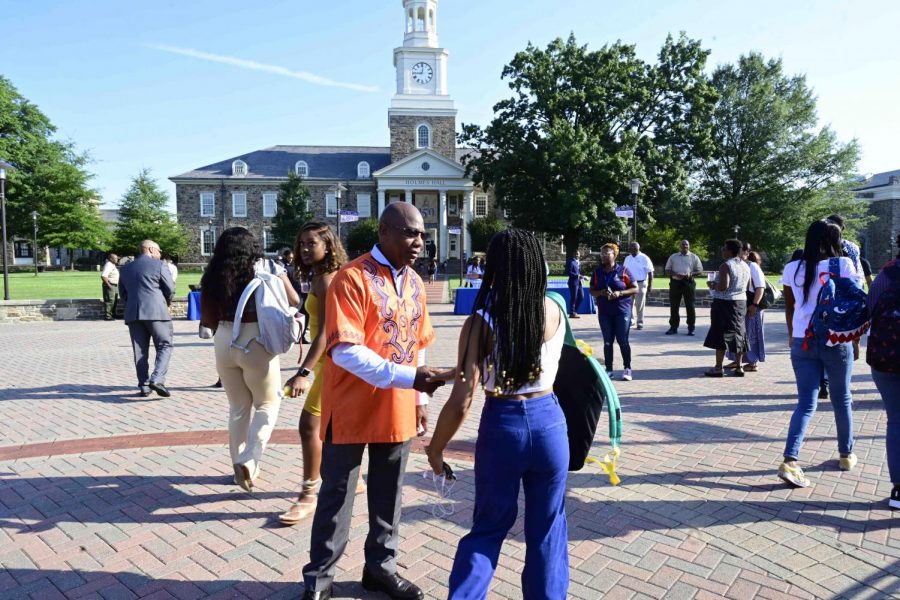 University President David Wilson greets students on the first day of the fall semester 2019. 