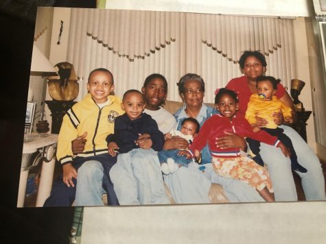 Evelyn Lorraine Miller(Center), her Daughter, Caroline McMillan(Right), and grandchildren,  including Brijhai McMillan (sitting in Evelyn’s lap in red).