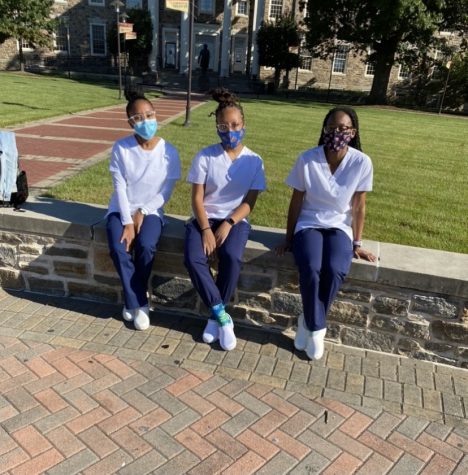 Alisha Ovide (right) poses with other fellow Morgan nursing students.