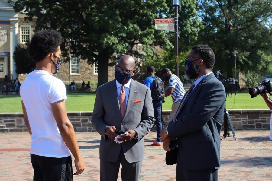 President David Wilson greeted students on their way to classes.