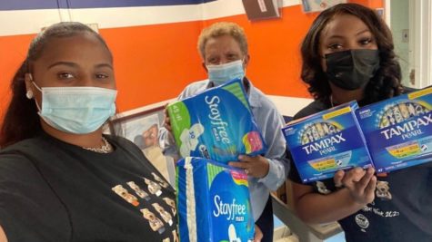 SGA President Jamera Forbes and Vice President DaiShona Jones poses with the feminine products shared on campus through the new sexual health program.