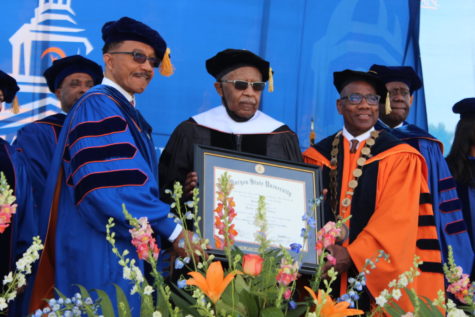David Burton poses with Congressman Kweisi Mfume and University President David Wilson after receiving his honorary degree.