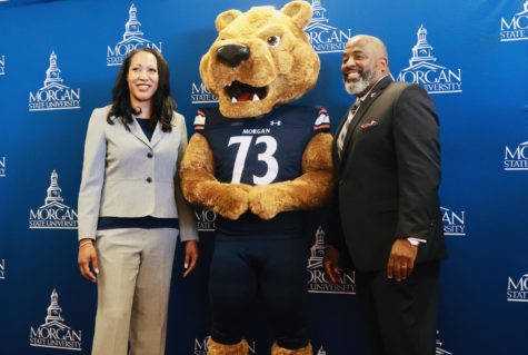 New football coach Damon Wilson poses with Benny the Bear and Dena Freeman-Patton, vice president and director for intercollegiate athletics.