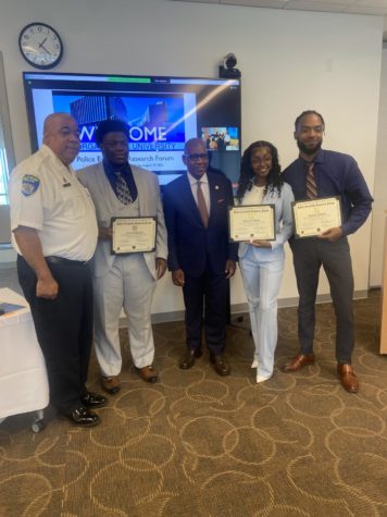 From left and right: Baltimore Police Commissioner Michael Harrison, intern Fortune Olayinka, Morgan State University President David Wilson, intern Yasmine Bryant, and intern Cheikh McKissic.