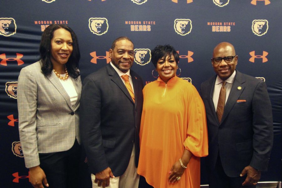 Dena Freeman-Patton, Coach Kenny Monday and wife Sabrina Monday, and Morgan State University President David Wilson poses after the press conference. 