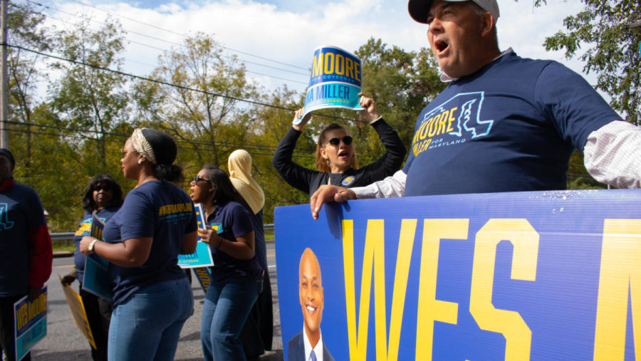 Volunteers for Wes More, Democratic candidate for Maryland State governor, hold signs and chant near the entrance of Maryland Public Television in Owing Mills, Md., Oct. 12. MPT hosted the 2022 Gubernatorial Debate between Moore and Cox. Voters have the opportunity to cast their votes on Tuesday, Nov. 8.