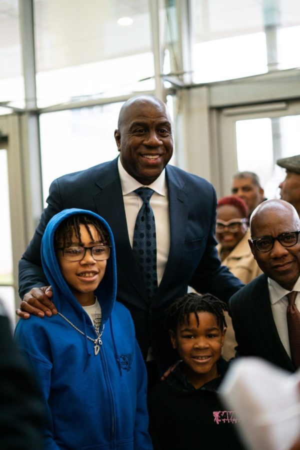 Magic Johnson poses with Morgan State University President David Wilson and fans in the Thurgood Marshall Dining Hall | February 20, 2023.
