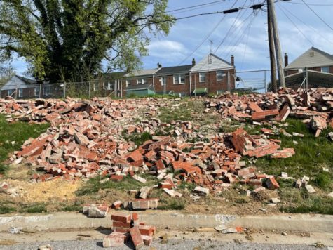 Sections of the historic spite wall was demolished Tuesday morning.