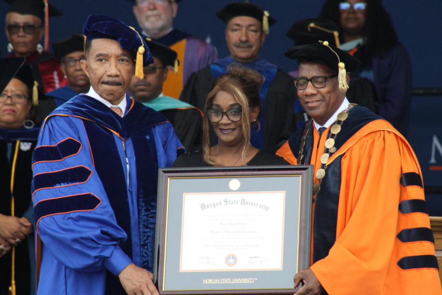 Board of Regents Chair Rep. Kweisi Mfume (D-Md.) and Morgan President David Wilson present a posthumous diploma to Sonya Halston-Thomas, the mother of Janay Thomas, who died Feb. 4, 2023 in a car accident, 