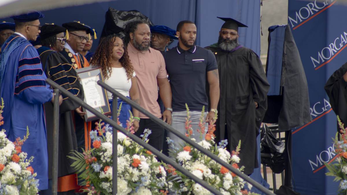 Rosalyn Roz Murray stands beside her family to accept a diploma on behalf of her daughter Kendall Murray during Morgan State Universitys spring 2024 commencement. Kendall Murray passed away in January 2024. (photo by Lillian Stephens, The Spokesman
