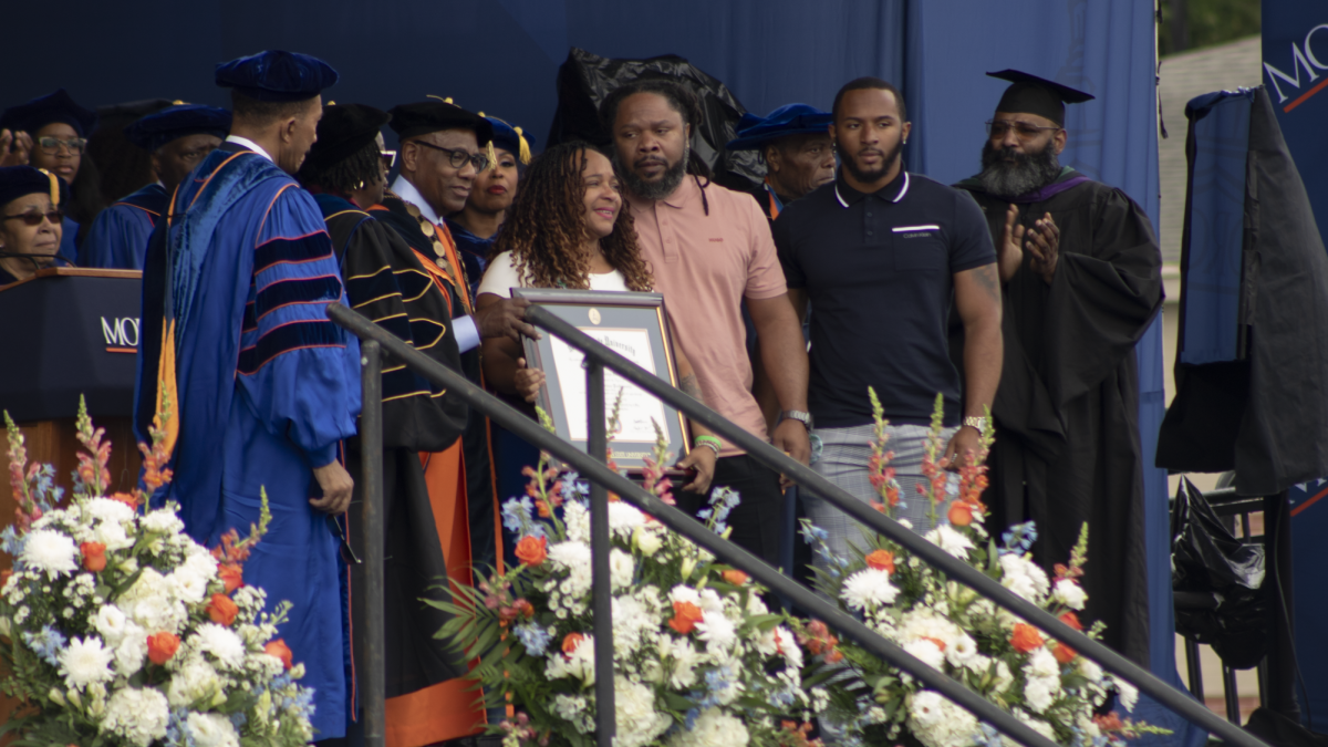 Rosalyn Roz Murray stands beside her family to accept a diploma on behalf od her daaughter Kendall Murray during Morgan State Universitys spring 2024 commencement. Kendall Murray passed away in Devember 2023. (photo by Lillian Stephens. The Spokesman