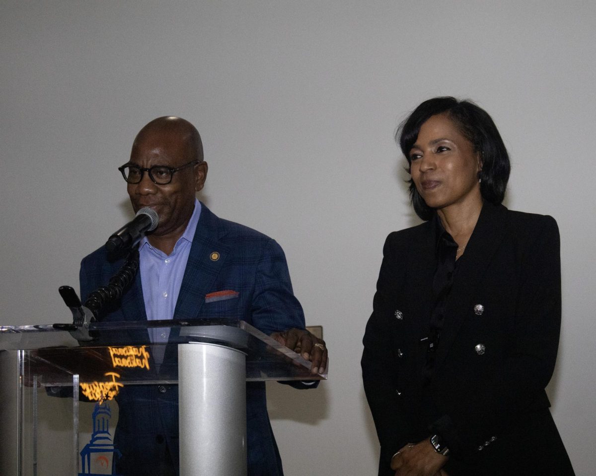 Morgan President David Wilson stands beside Angela Alsobrooks.