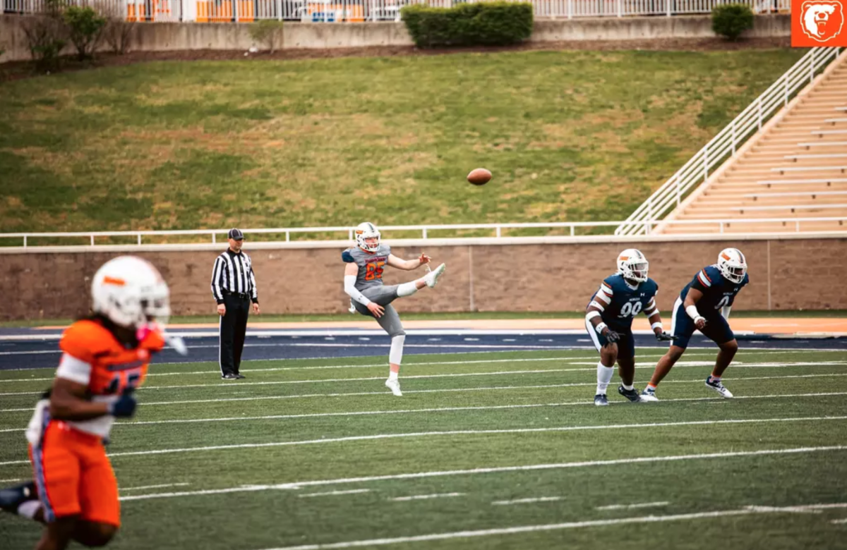 Shane Messenger, sophomore punter for Morgan State University's Football team, punts during a Blue versus Orange spring football game. (Morgan athletics photo by Jadon Pace)