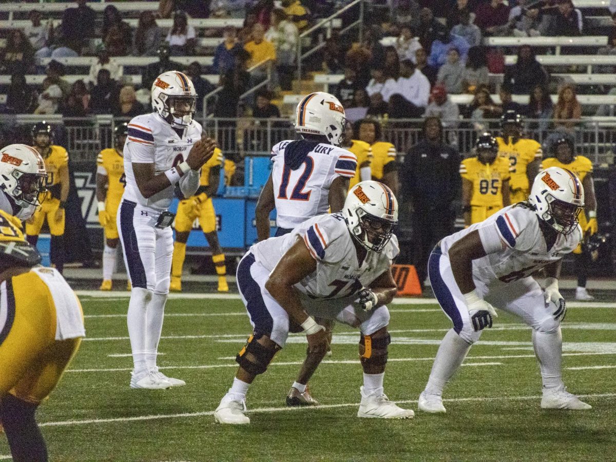 Thaj Smith sends Malique Leatherbury in motion vs Towson (MSU Spokesman photo by Zion Pittman)