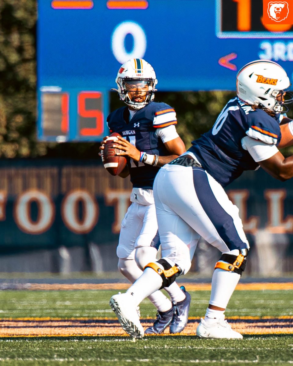 Bears' quarterback Deuce Taylor drops back to pass vs Merrimack College. (Jake Bandoh/ MSU Creatives)