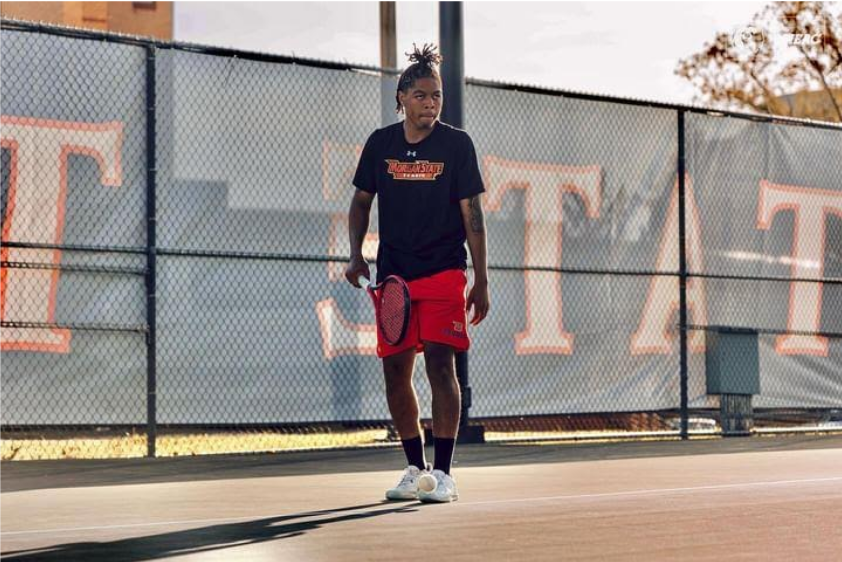 Rhajzon “Rha” Rankins stands on the tennis court during Tennis practice in the spring 2024 semester.