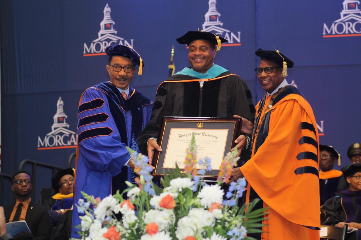 Rep. Kweisi Mfume (D-7th), chairman of Morgan's Board of Regents (left) and Morgan President David wilson present  Ed Gainey an honorary doctorate during the fall commencement ceremony on Dec. 13, 2024. Ed Gainey graduated from Morgan in 1994 and is the Mayor of Pittsburgh.