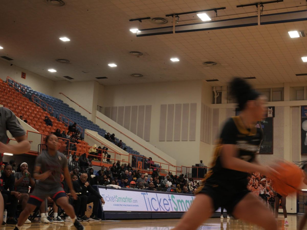 Head coach of the Women's Basketball Team Ed Davis. sits courtside during the game between Morgan and Towson University Nov. 14, 2024. Davis  announced his retirement following the MEAC tournament .  