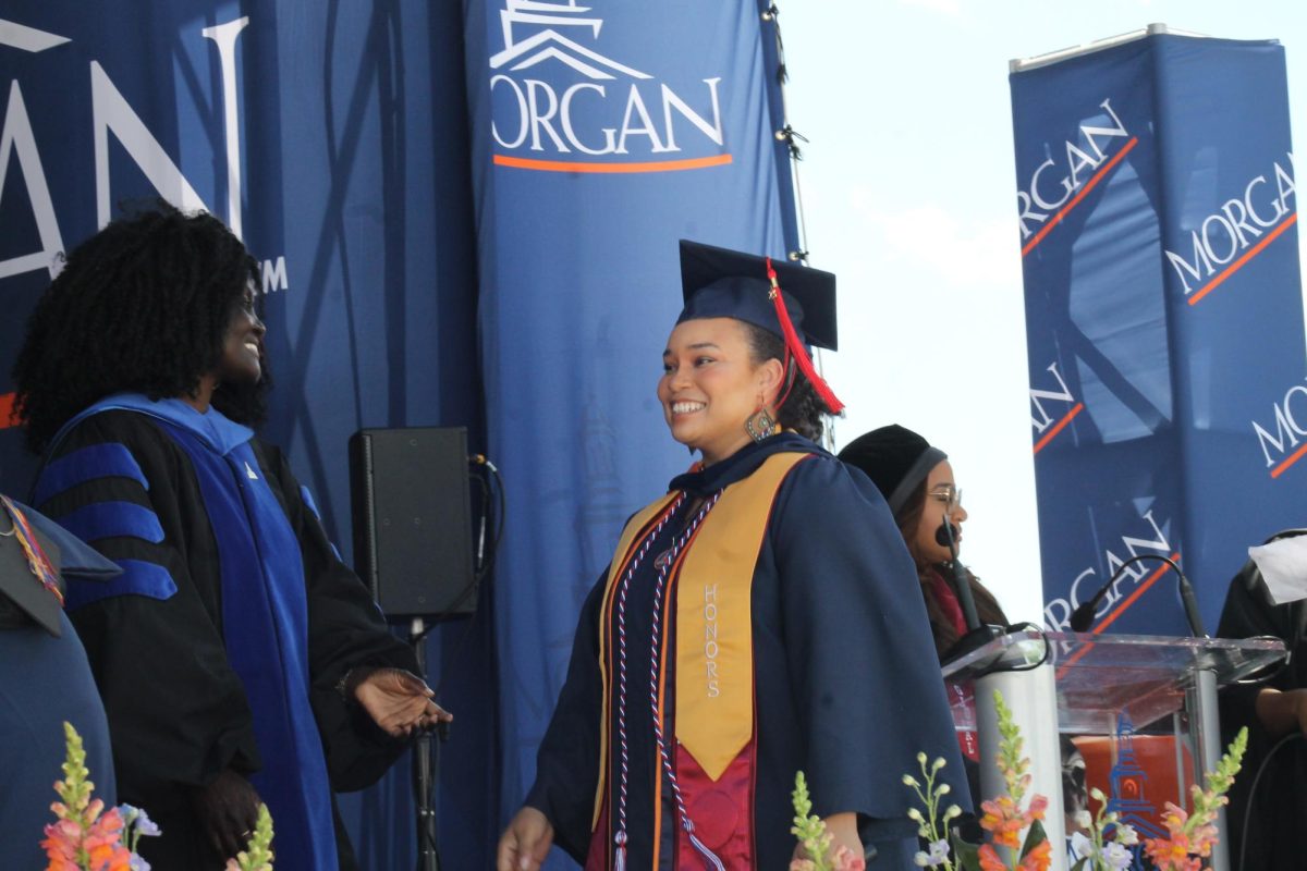 Former Spokesman editor-in-chief Lillian Stephens prepares to receive her diploma Saturday