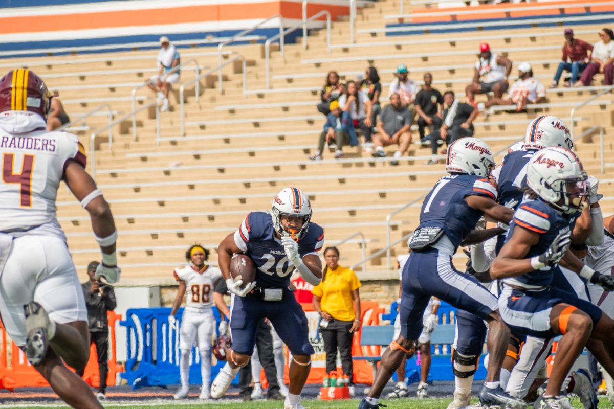 Redshirt freshman running back Randall Nauden on a rushing attempt against Central State.