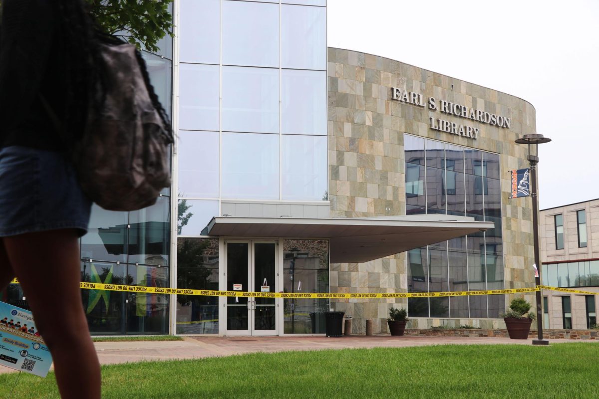 Morgan State University student walks past an evacuated Earl S. Richardson Library on Tuesday, Sept. 30, 2025. 